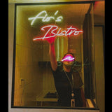 Neon Sign - Custom made for Fiona's Bistro with yellow & red accent glow.